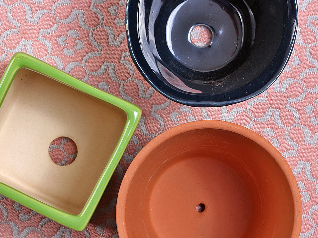 Pots showing drainage holes.